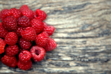 Fresh organic red raspberries. Composition with non-gmo red raspberries on the table. The concept of health, non-gmo products, clean ecological food.