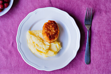 plate with mashed potatoes and cutlets. children's menu.