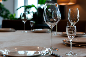 Empty wine glasses are on the table in the restaurant.