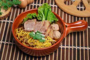 Braised beef egg noodles with meatballs. Popular street food, Thai food.