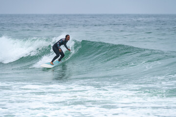 Surfer girl riding a wave