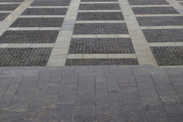 Abstract background. modern cobblestone pavement. Sidewalk made of gray stones