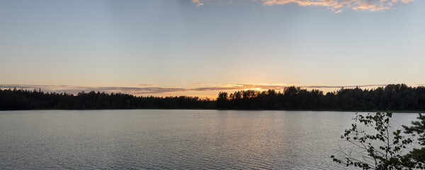 sunset panorama over forest lake
