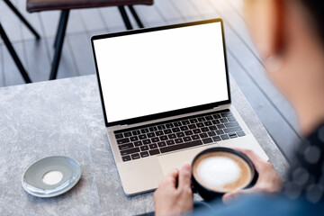 computer screen blank mockup.hand woman work using laptop with white background for advertising,contact business search information on desk at coffee shop.marketing and creative design