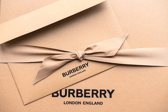 BERLIN, GERMANY - March  27., 2021, Burberry brand gift box. Elegantly decorated gift. Burberry scarf in traditional color and pattern.
