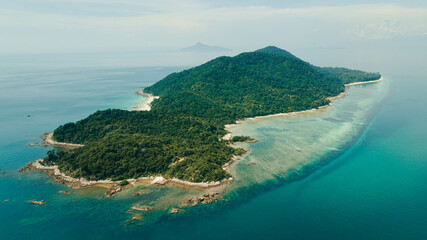 Aerial drone view of tropical island scenery at Besar Island or Pulau Besar in Mersing, Johor, Malaysia