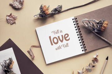 Caption motivator text Fall in love with Fall in square album, notebook with spiral binder. Wooden...