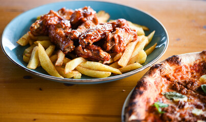 crispy barbecue chicken wings with fries