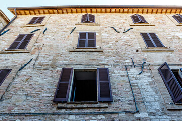 Fototapeta na wymiar Facade of an old building in the historic center of Assisi, Umbria, Italy, Europe