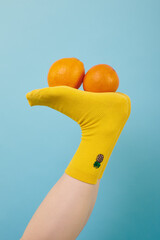 creative yellow socks with the image of a pineapple on a blue background with orange oranges on the...