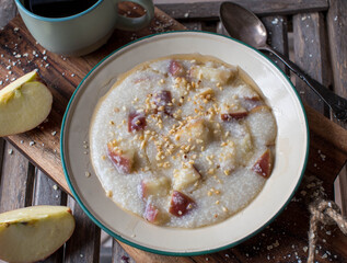 Millet porridge with apples, nuts and maple syrup
