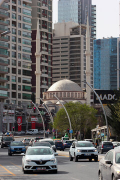 Ankara, Turkey - April 18, 2022: Firdaws Mosque and modern residential buildings in Cankaya Kizilirmak district of Ankara.