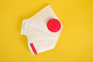 FFP3 class filtering mask respirator isolated on yellow background side view.
