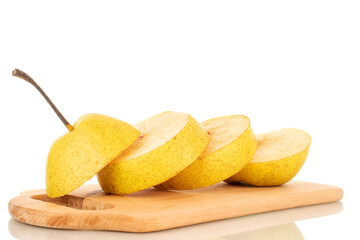 One juicy yellow pear cut into quarters on a wooden cutting board, close-up, isolated on a white background.