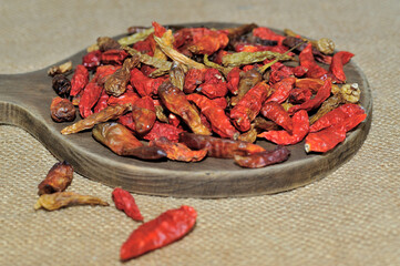 dried red chilies on a wooden cutting board