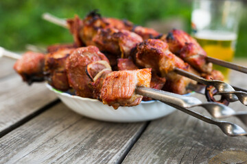 Top view of tasty shish kebab from pork on plate