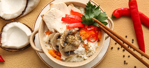 Pot with tasty Thai soup on color background