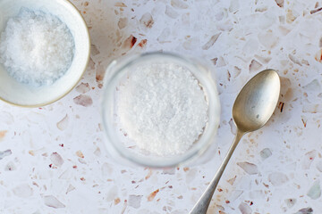 Jar of salt with spoon.