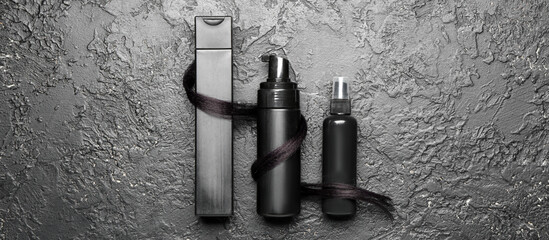 Set for hair treatment on dark background, top view