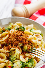 orequette pasta with broccoli on a white background