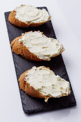 baguette cream cheese sandwich on a white background
