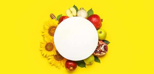 Composition for Rosh Hashanah (Jewish New Year) with blank card on yellow background