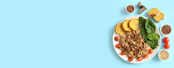 Composition with tasty oatmeal on light blue background with space for text, top view