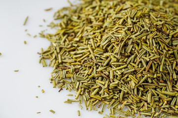 fragrant dried rosemary on a white acrylic background