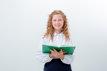 schoolgirl teenage girl in school uniform holding a book on a white background