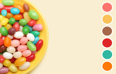 Plate of sweet candies on light background. Different color patterns