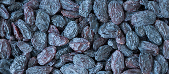 Dark raisins or currants, close-up, top view, macro.