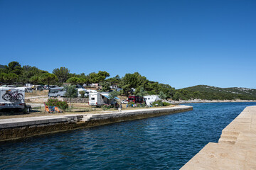 Fototapeta na wymiar Picture of the canal separating Cres and Losinj islands. Osor, Cres island, the Adriatic Sea, Croatia