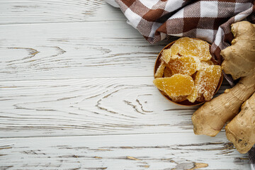 spicy dried ginger on a white wooden rustic background