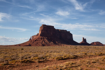 Fototapeta na wymiar Desert Rocky Mountain American Landscape. Sunny Blue Sky Day. Oljato-Monument Valley, Utah, United States. Nature Background