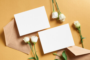 Wedding invitation card mockup with envelope and white eustoma flowers, front and back sides