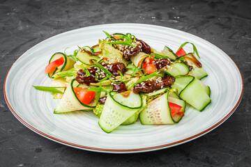 delicious fresh beef salad on a black background
