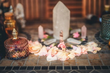 beautiful altar with crystals and rose flowers.