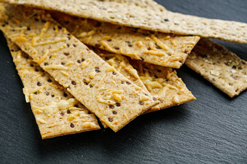 diet crispy bread on a black stone background