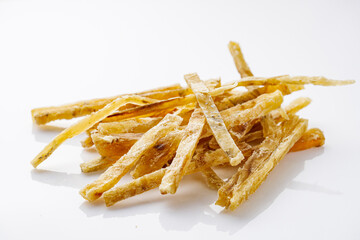 dried fish beer snack on a white acrylic background