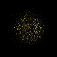 A circle of gold dust with many small particles of different scales on a black background. Gold glitters.