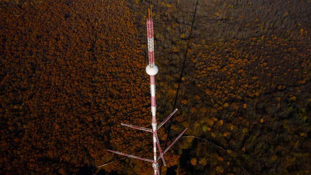 Television tower in autumn forest. Aerial drone view. Vinnytsia, Ukraine.