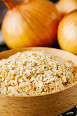 dried onions on a black wooden rustic background