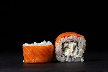 Rolls on a black background. Traditional Japanese food.