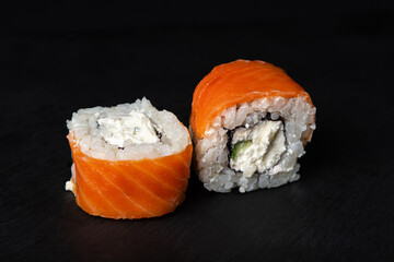 Rolls on a black background. Traditional Japanese food.