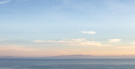 Panoramic View of Cloudscape during a colorful sunset or sunrise. Taken on the West Coast of British Columbia, Canada.