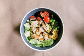 Poke bowl with chicken fillet and avocado