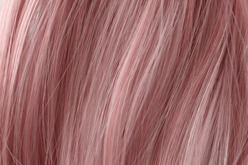 Pink curly hair texture closeup. Pink hair background.