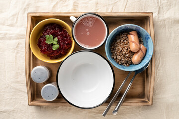 Set lunch in bowls in a wooden serving box. Food and catering concept. Open container for food