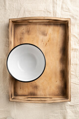 Empty dinner bowls in a wooden serving box. Food and catering concept. Open container for food