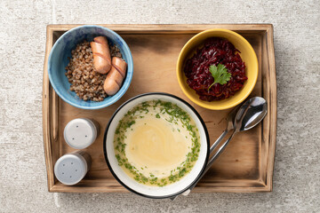 Complete healthy lunch with first and second course, salad and berry drink, top view. Food diversity concept